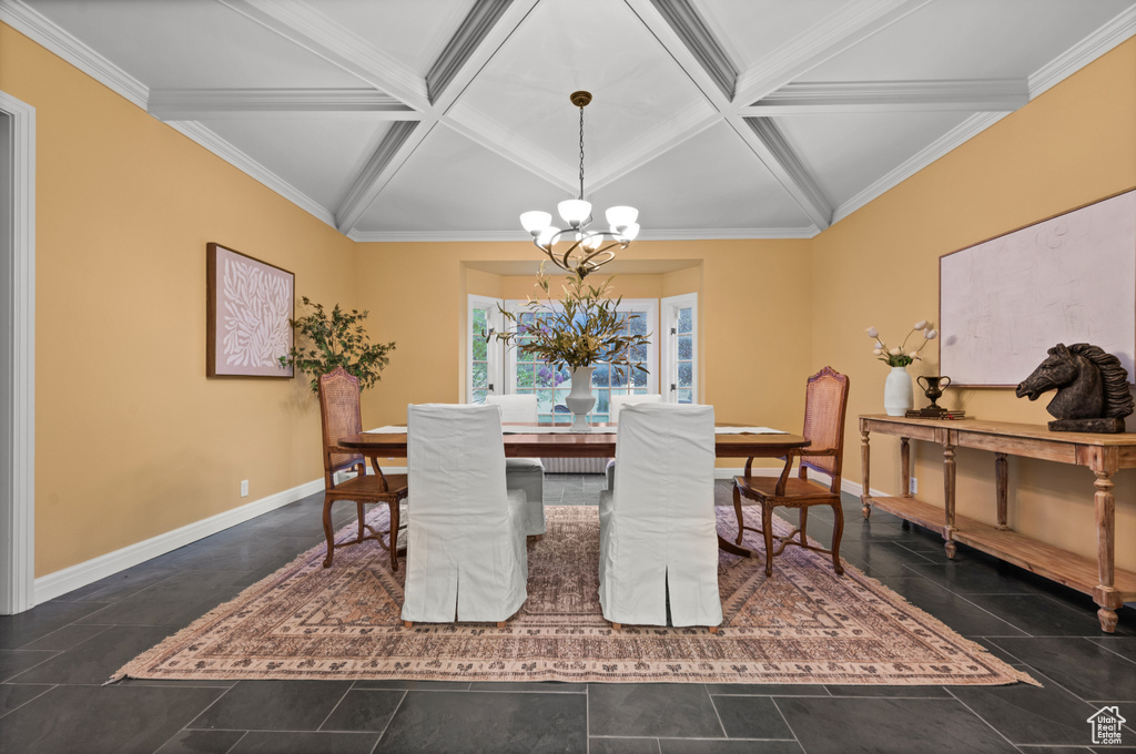 Tiled dining space with beam ceiling, a chandelier, crown molding, and coffered ceiling