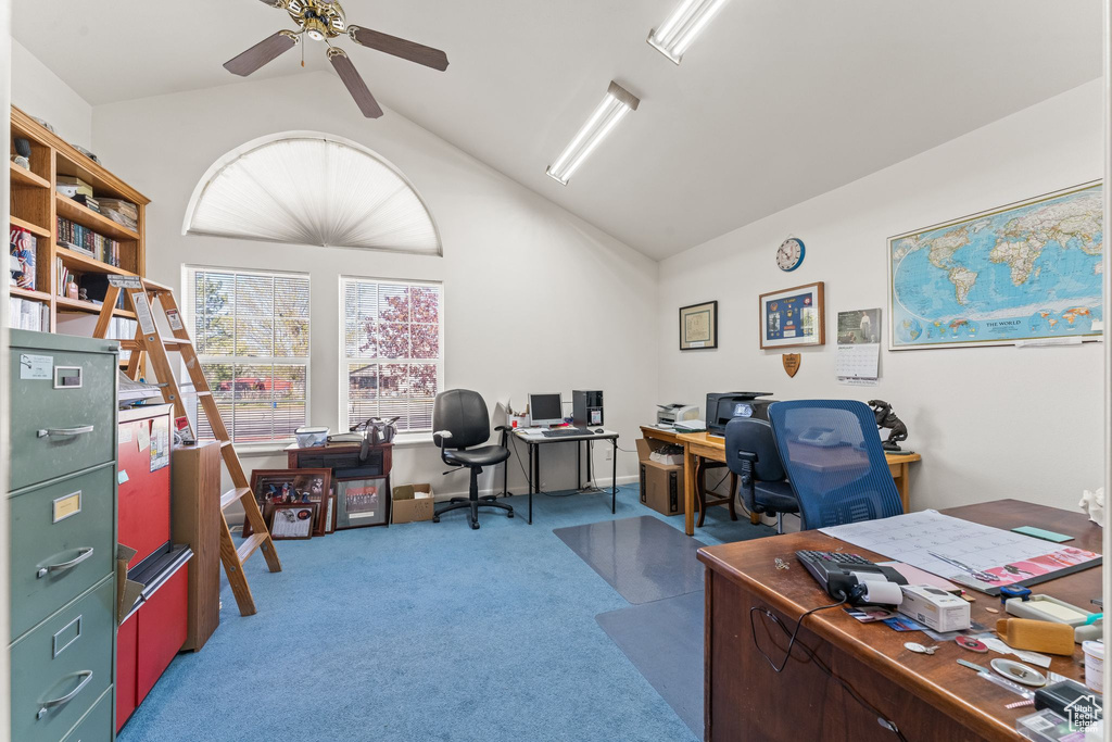 Carpeted office with ceiling fan and vaulted ceiling