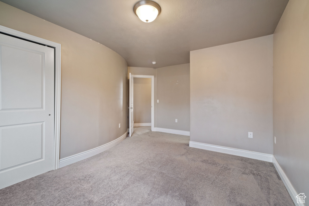 Unfurnished room with carpet floors