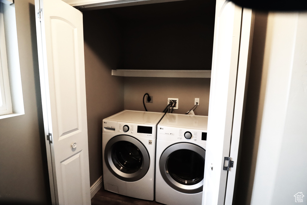 Laundry room with independent washer and dryer, dark hardwood / wood-style floors, hookup for an electric dryer, and hookup for a washing machine