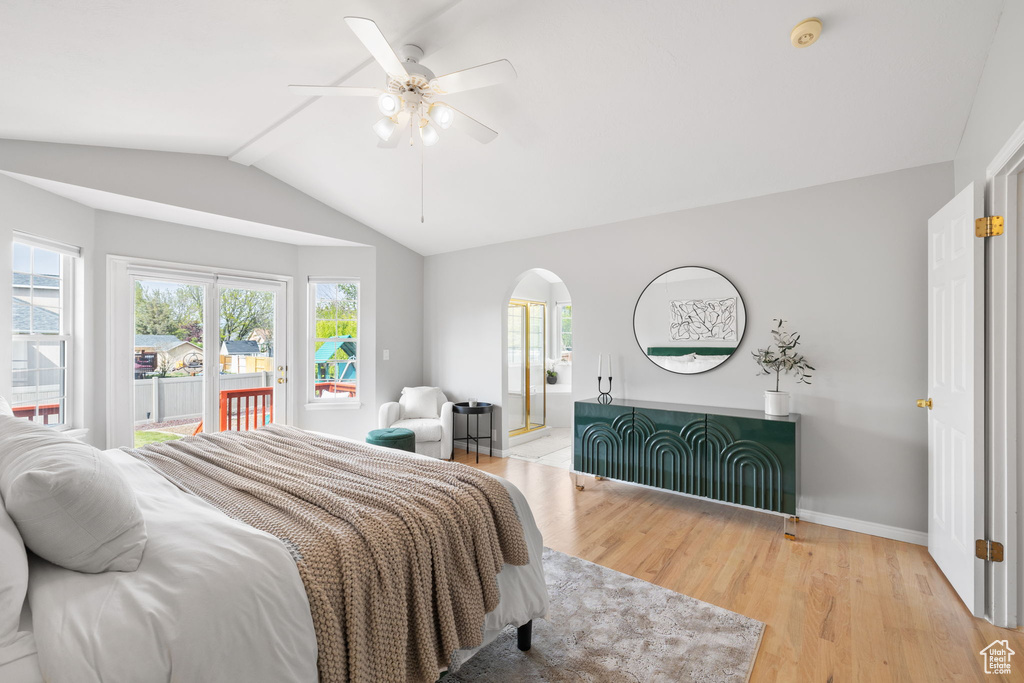 Bedroom with ceiling fan, vaulted ceiling, and light hardwood / wood-style floors