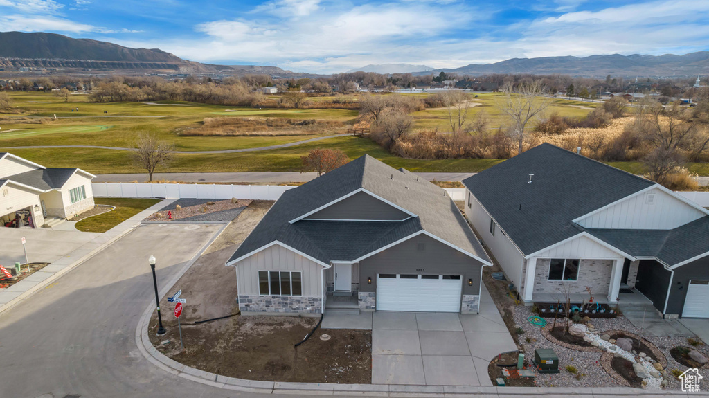 Birds eye view of property with a mountain view