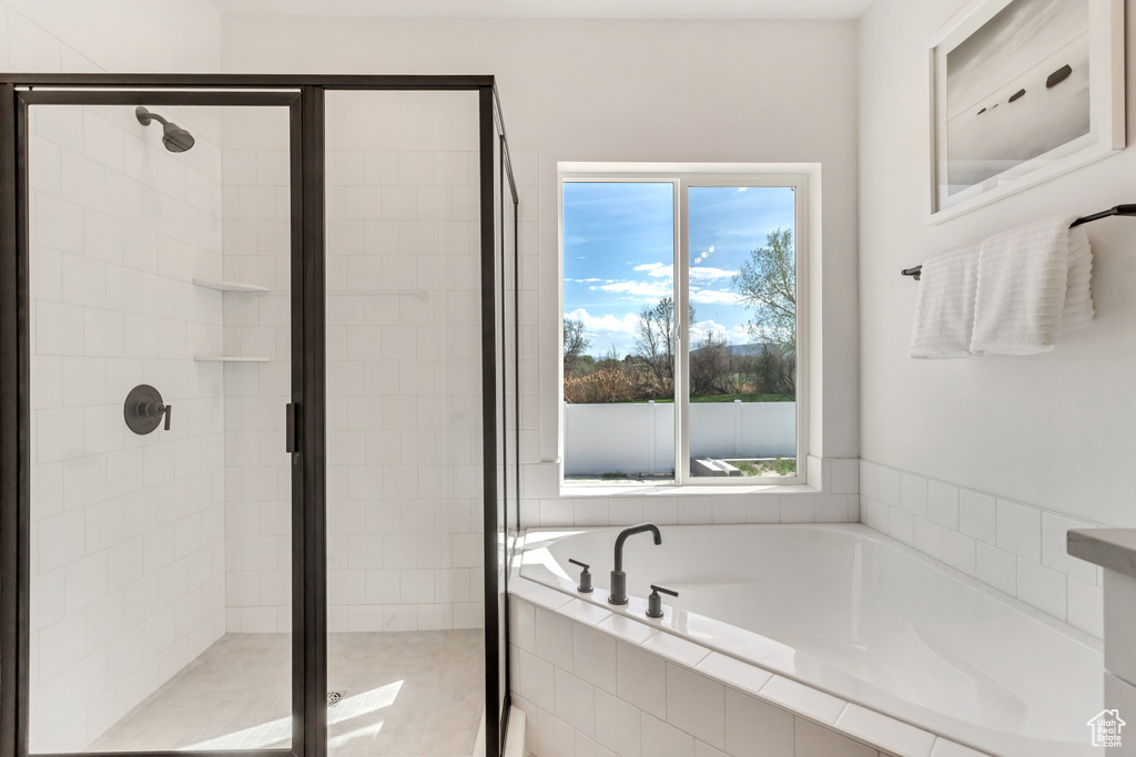 Bathroom featuring separate shower and tub