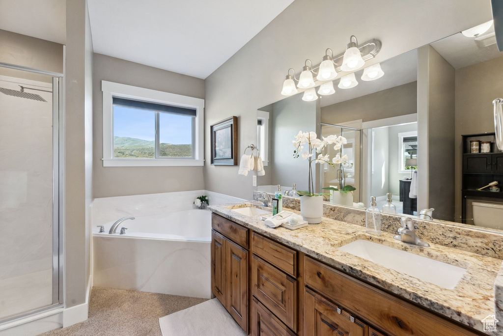 Bathroom with double vanity and separate shower and tub