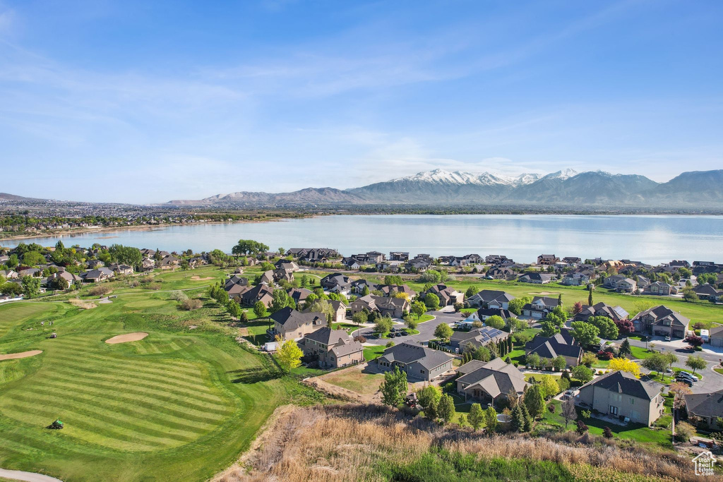 Birds eye view of property featuring a water and mountain view