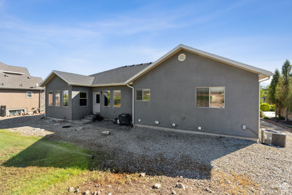 Back of property with central air condition unit