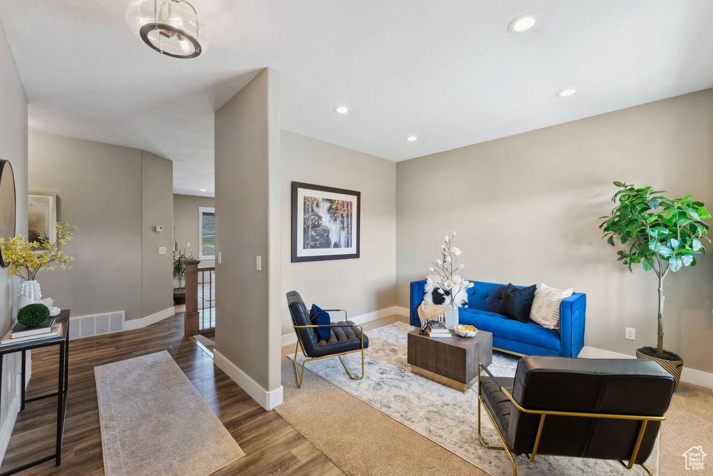 Living room with hardwood / wood-style flooring