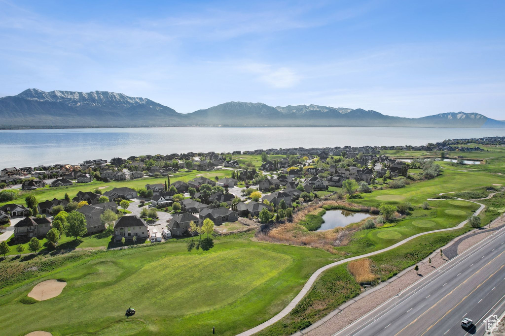 Birds eye view of property featuring a water and mountain view