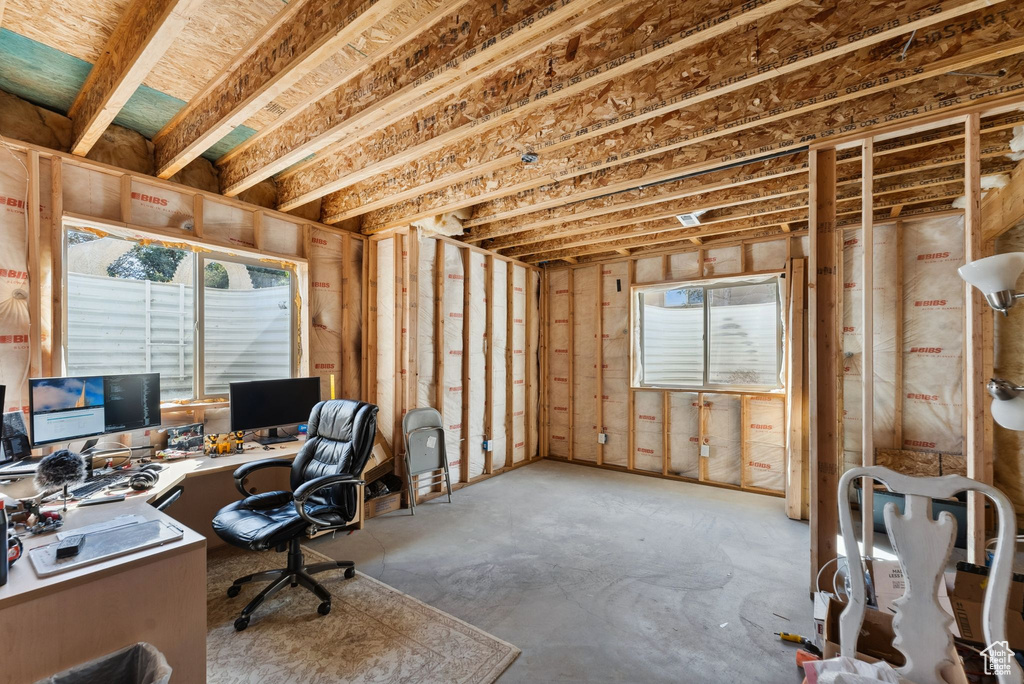 Office area featuring concrete floors