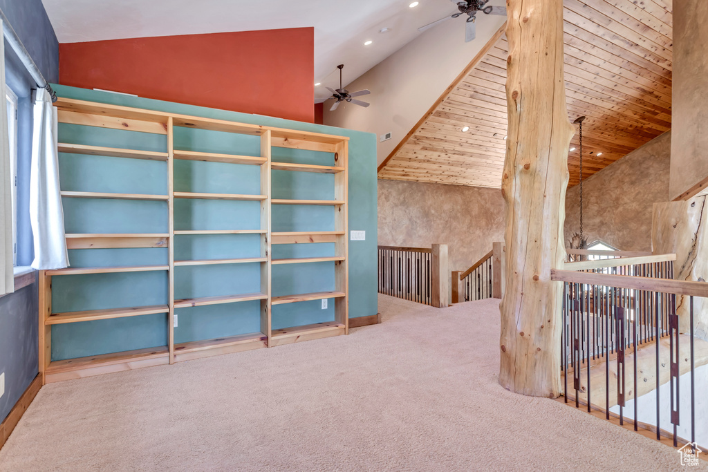 Bonus room with wood ceiling, high vaulted ceiling, ceiling fan, and carpet floors