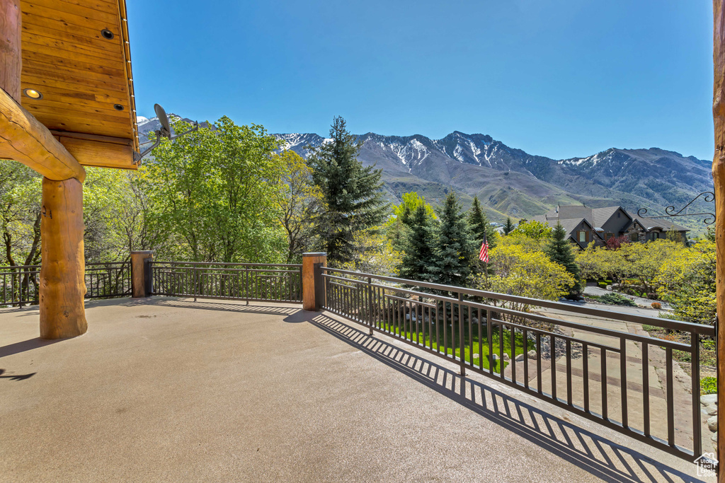 View of terrace with a mountain view and a balcony