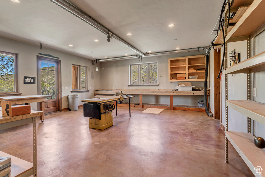 Recreation room featuring concrete flooring