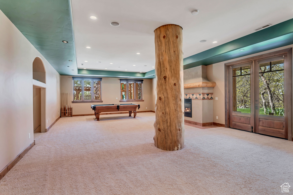 Recreation room with pool table and carpet floors