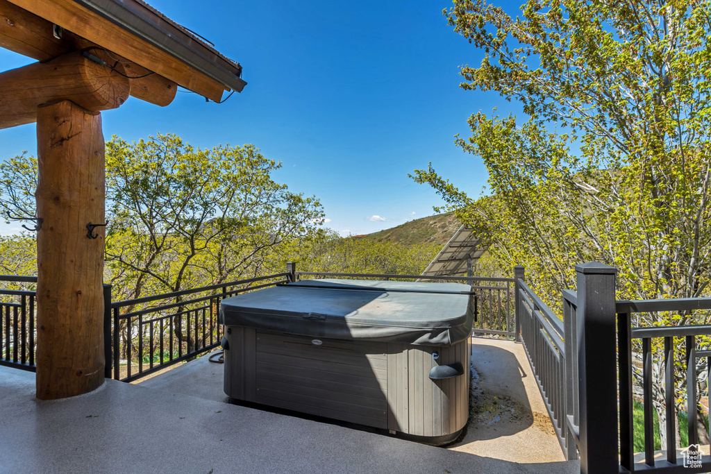 View of terrace featuring a hot tub