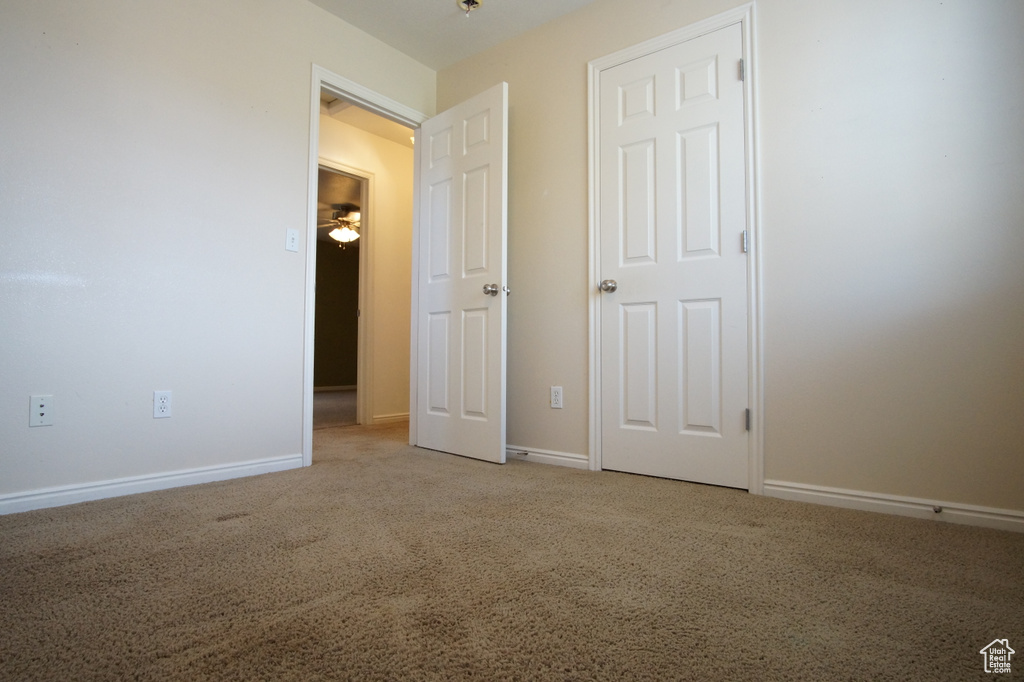 Unfurnished bedroom with carpet floors