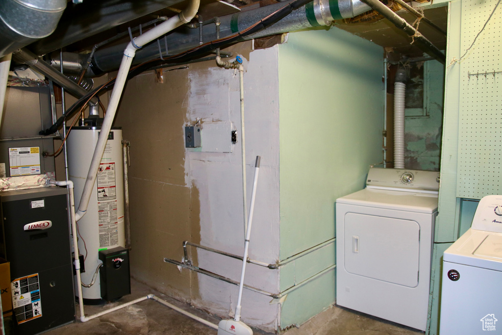 Clothes washing area with gas water heater and washer and clothes dryer
