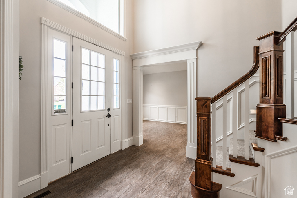 Entrance foyer with hardwood / wood-style floors and a wealth of natural light