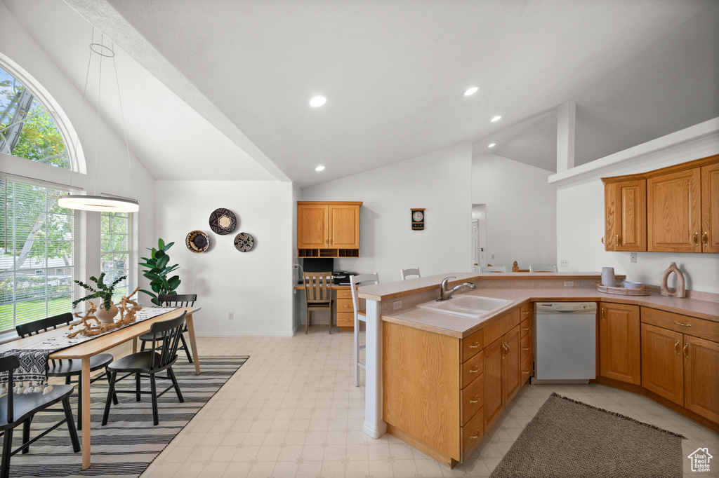 Kitchen featuring sink, kitchen peninsula, dishwasher, and light tile floors