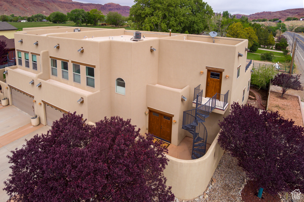 Exterior space with a mountain view and a garage