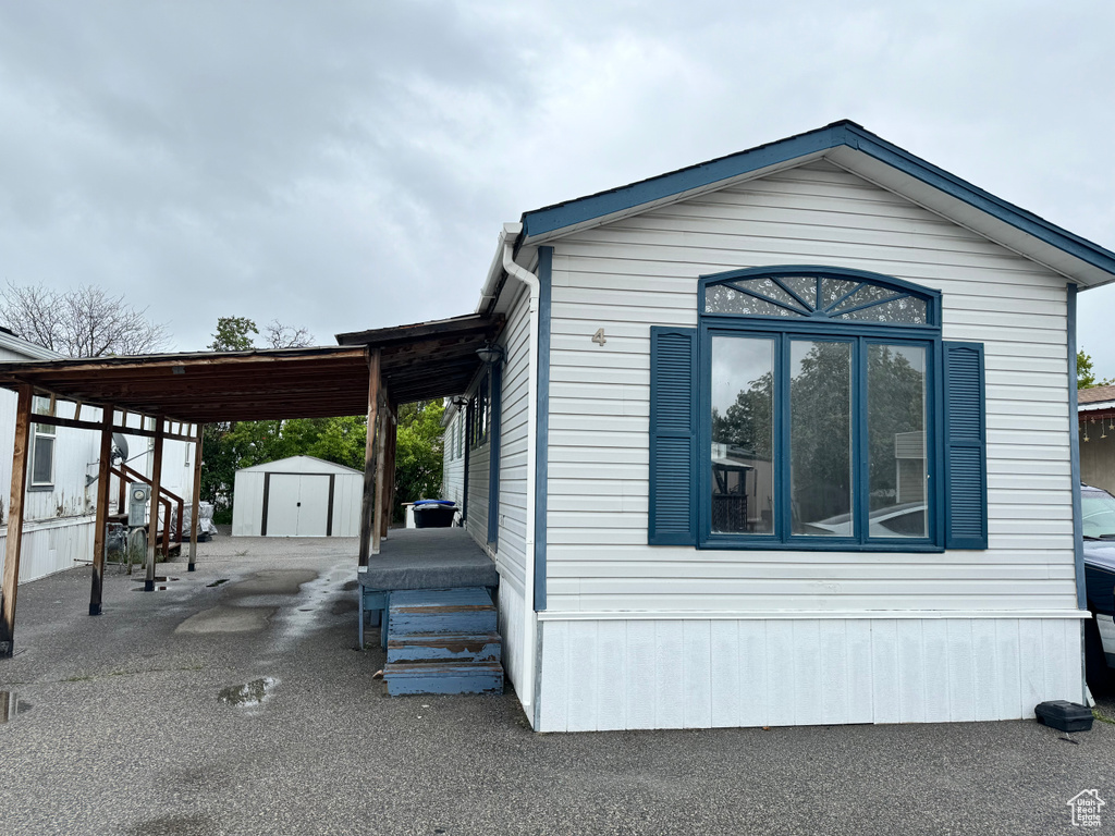 View of home\'s exterior featuring a shed
