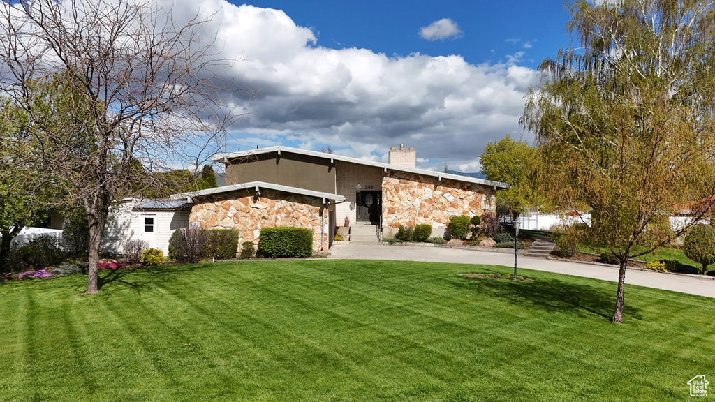 View of front of home with a front lawn