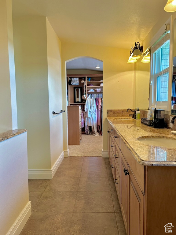 Bathroom featuring sink and tile floors