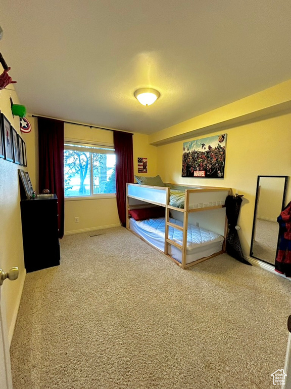 Unfurnished bedroom with carpet flooring