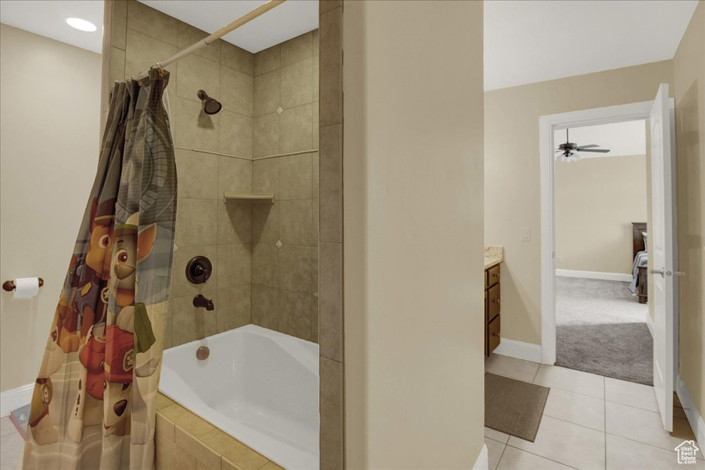 Bathroom featuring shower / bath combo, vanity, and tile flooring