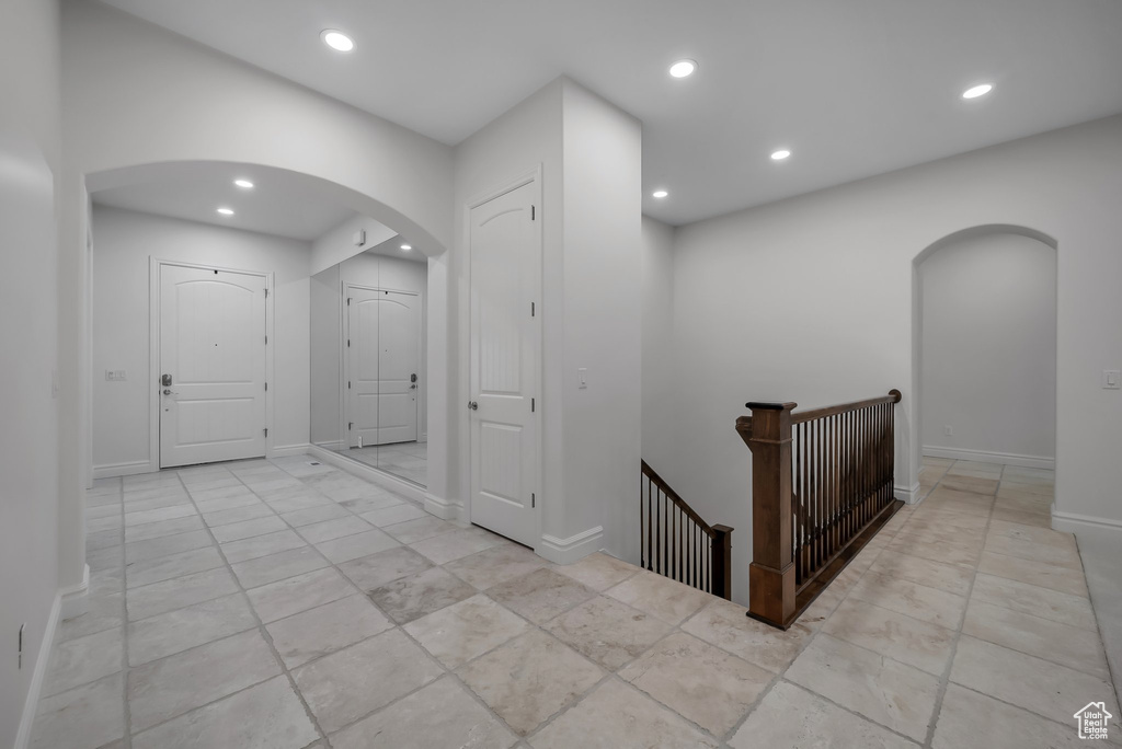 Hall featuring light tile floors