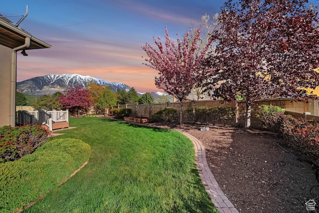 Yard at dusk with a mountain view