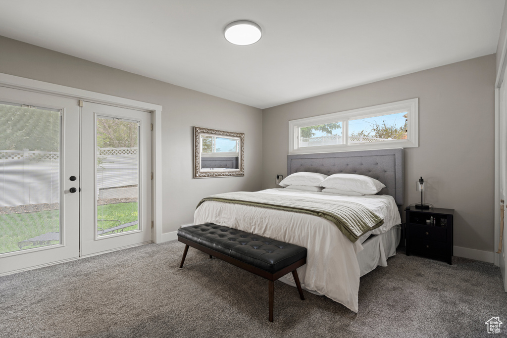 Bedroom featuring french doors, access to outside, and carpet flooring
