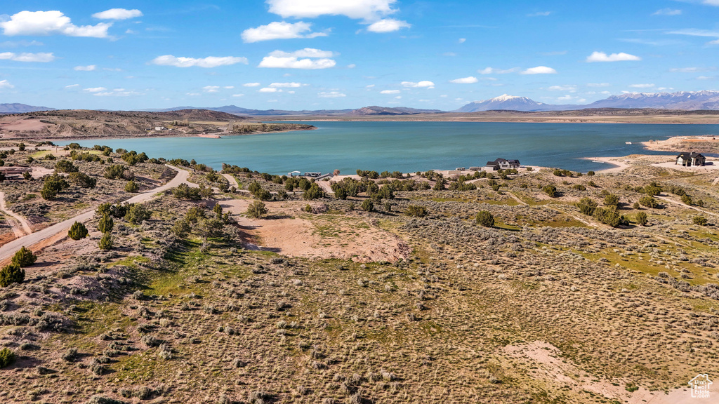 Exterior space featuring a water and mountain view