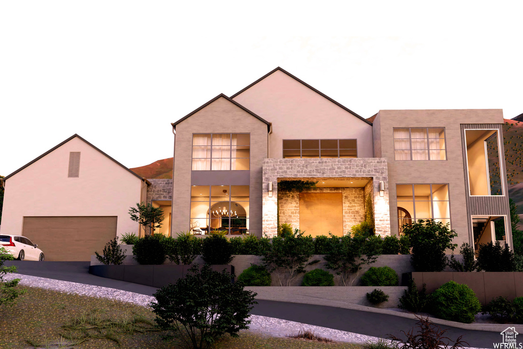 View of front facade featuring a garage