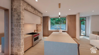 Kitchen featuring a center island, pendant lighting, stove, and light wood-type flooring