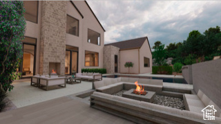 View of patio featuring an outdoor living space with a fire pit