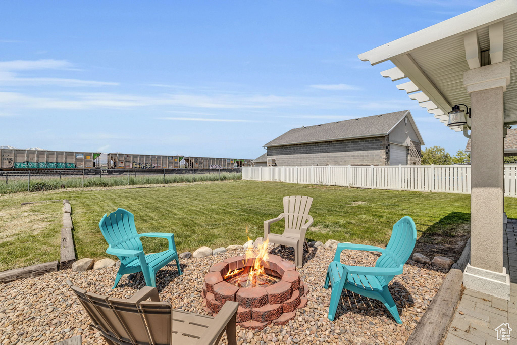 View of yard featuring a fire pit