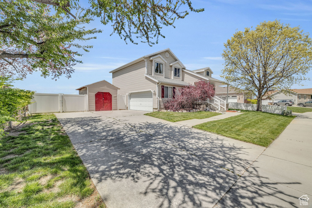 View of property featuring a front yard