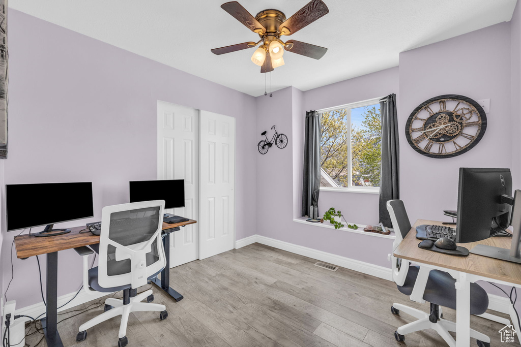 Office area featuring light hardwood / wood-style flooring and ceiling fan