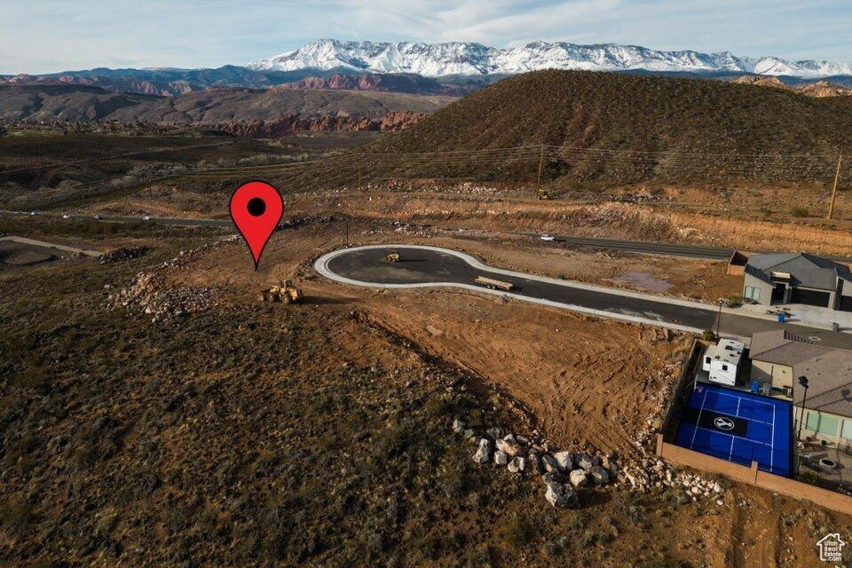 Birds eye view of property with a mountain view