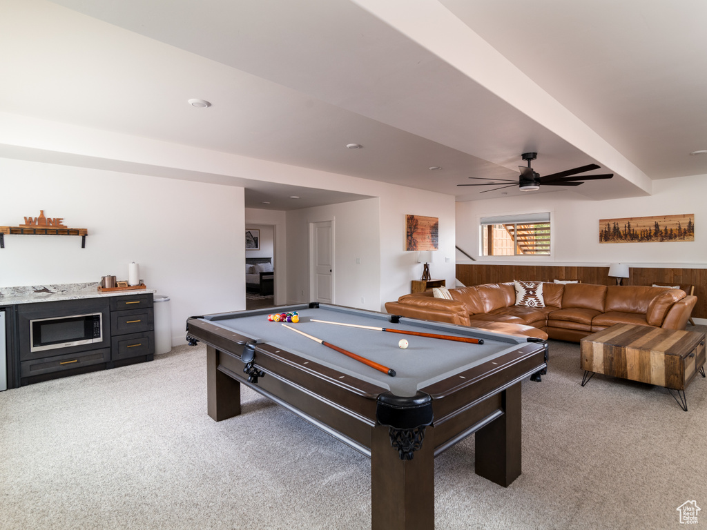Recreation room with light colored carpet, ceiling fan, and billiards