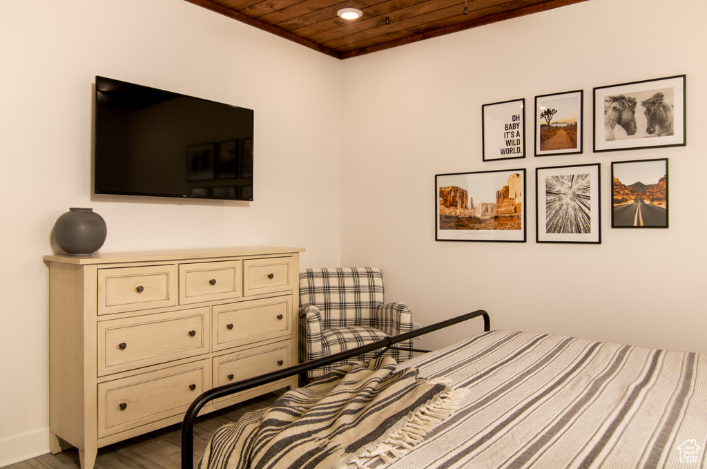 Bedroom featuring hardwood / wood-style floors and wooden ceiling