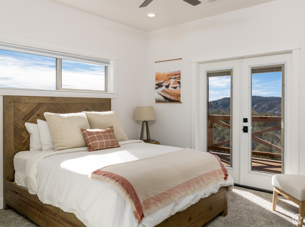 Bedroom featuring french doors, carpet, ceiling fan, and access to exterior