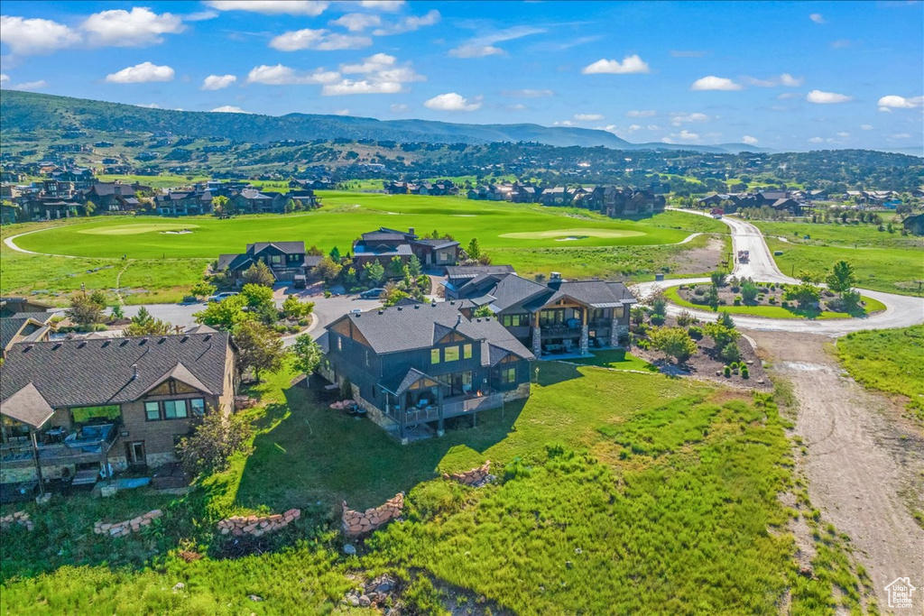 Birds eye view of property with a mountain view