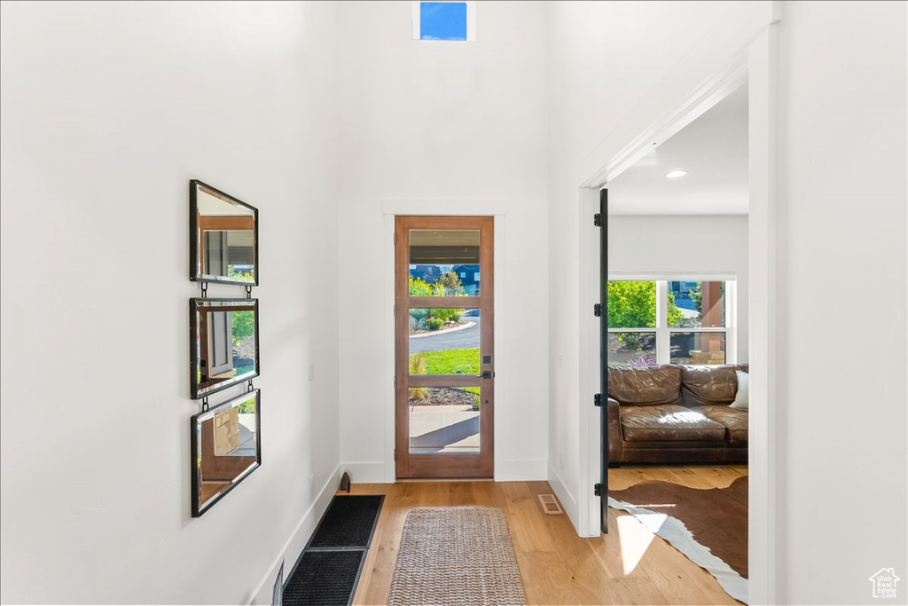 Entrance foyer featuring light hardwood / wood-style flooring