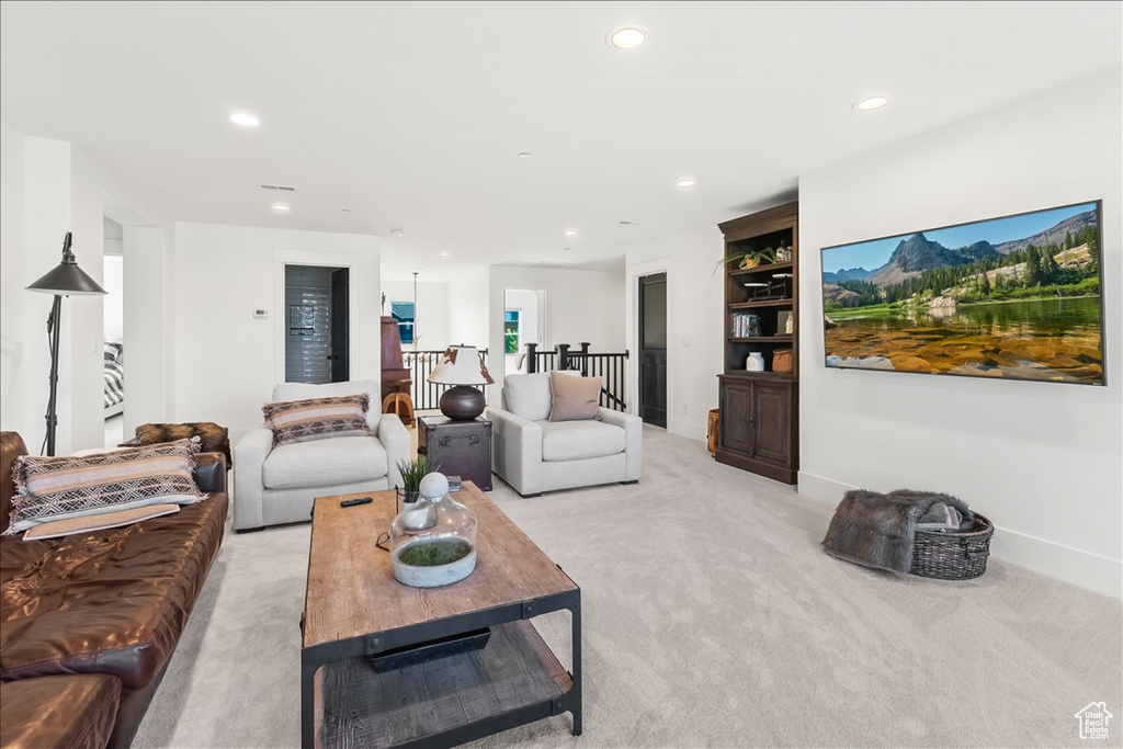 Living room featuring light colored carpet