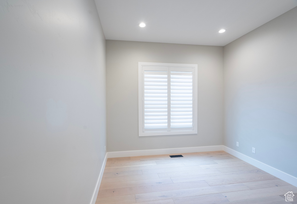 Unfurnished room with light hardwood / wood-style flooring