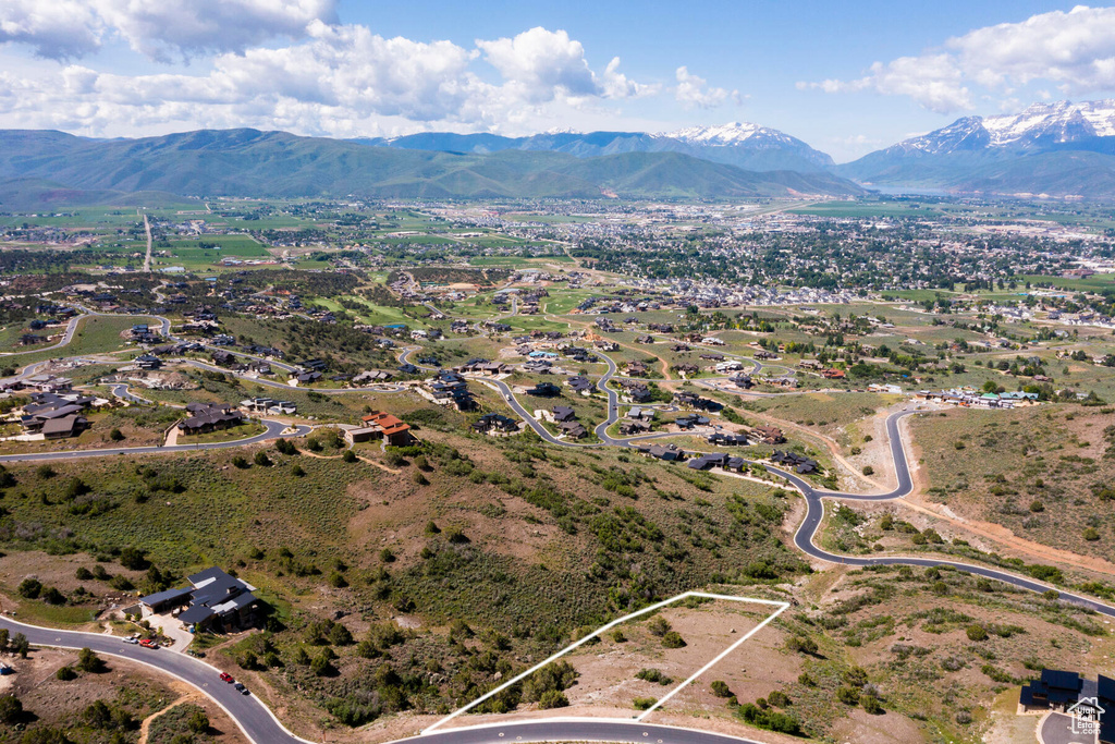 Birds eye view of property with a mountain view