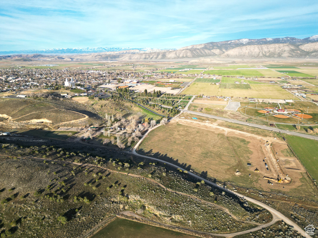 Birds eye view of property with a mountain view