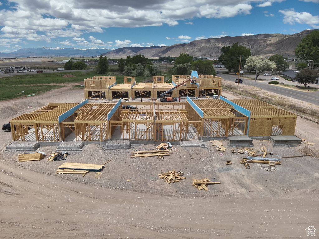 Birds eye view of property with a mountain view