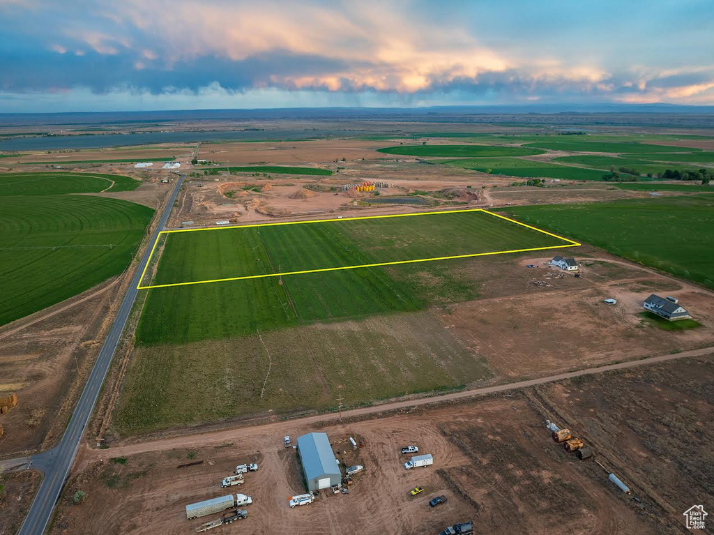 Aerial view at dusk featuring a rural view